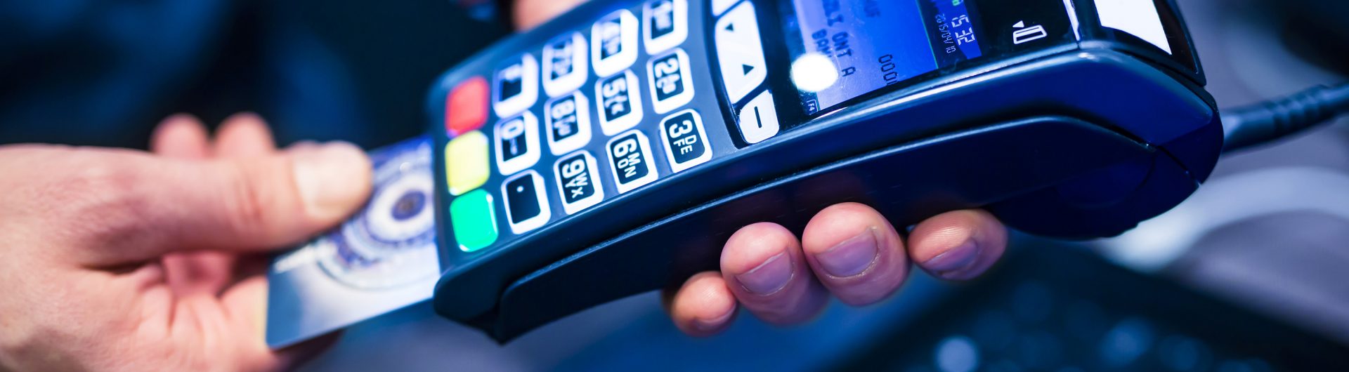 man put the credit card into a reader