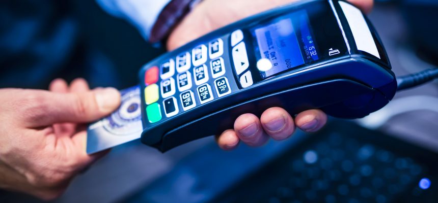 man put the credit card into a reader