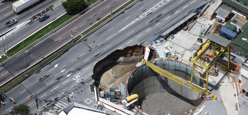 An aerial view shows part of an expressway collapsed above a construction site where Spain's Acciona SA was excavating a tunnel for a new metro line in Sao Paulo, Brazil, February 1, 2022. REUTERS/Carla Carniel