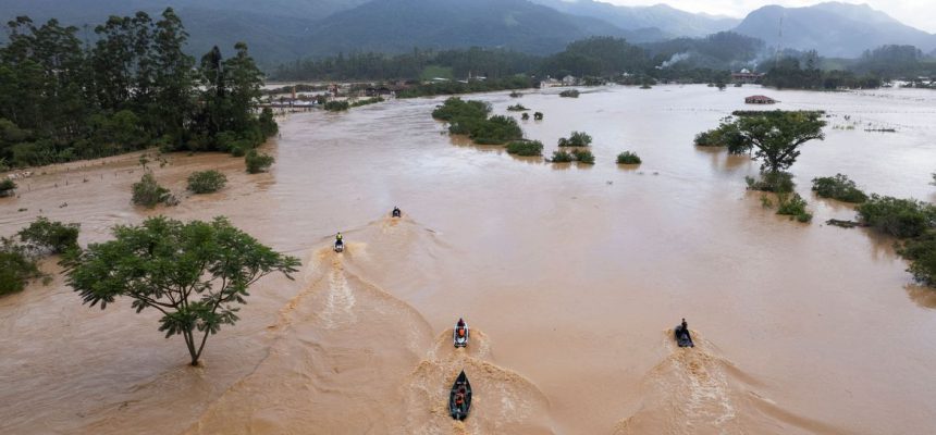 Volunteers search for residents after heavy rains in Canelinha, in Santa Catarina state, Brazil, December 1, 2022. REUTERS/Anderson Coelho